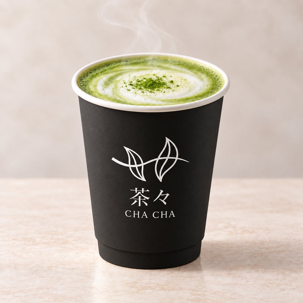 Hot matcha latte in a black CHACHA cup