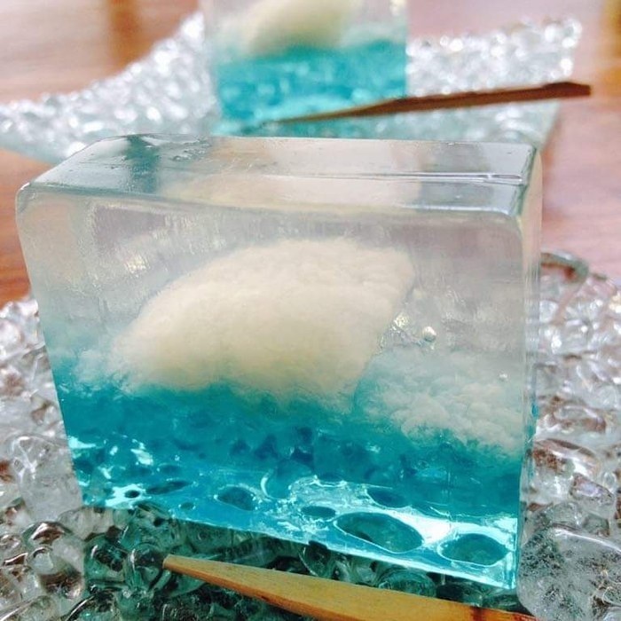 A clear wagashi with a blue wave inside